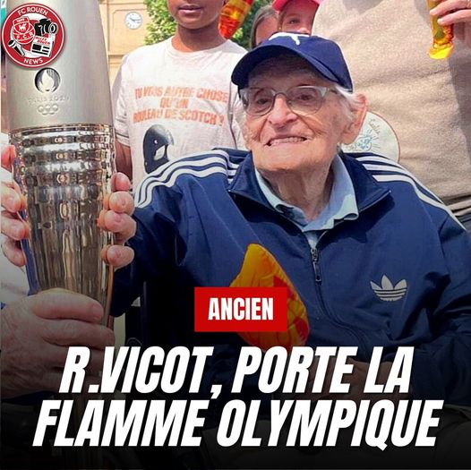 Robert Vicot porte la flamme olympique..jpg